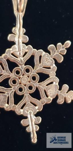 Gold colored snowflake pendant, marked 14K on gold colored rope necklace, marked 14KT Italy,