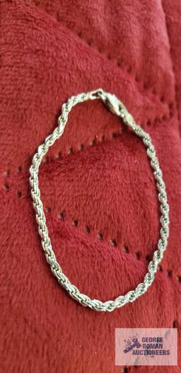Silver colored rope bracelet, marked 925 Italy, approximate total weight is 4.74 G