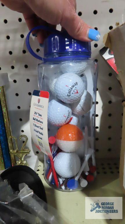 Golf balls, trophies, and other golfing items