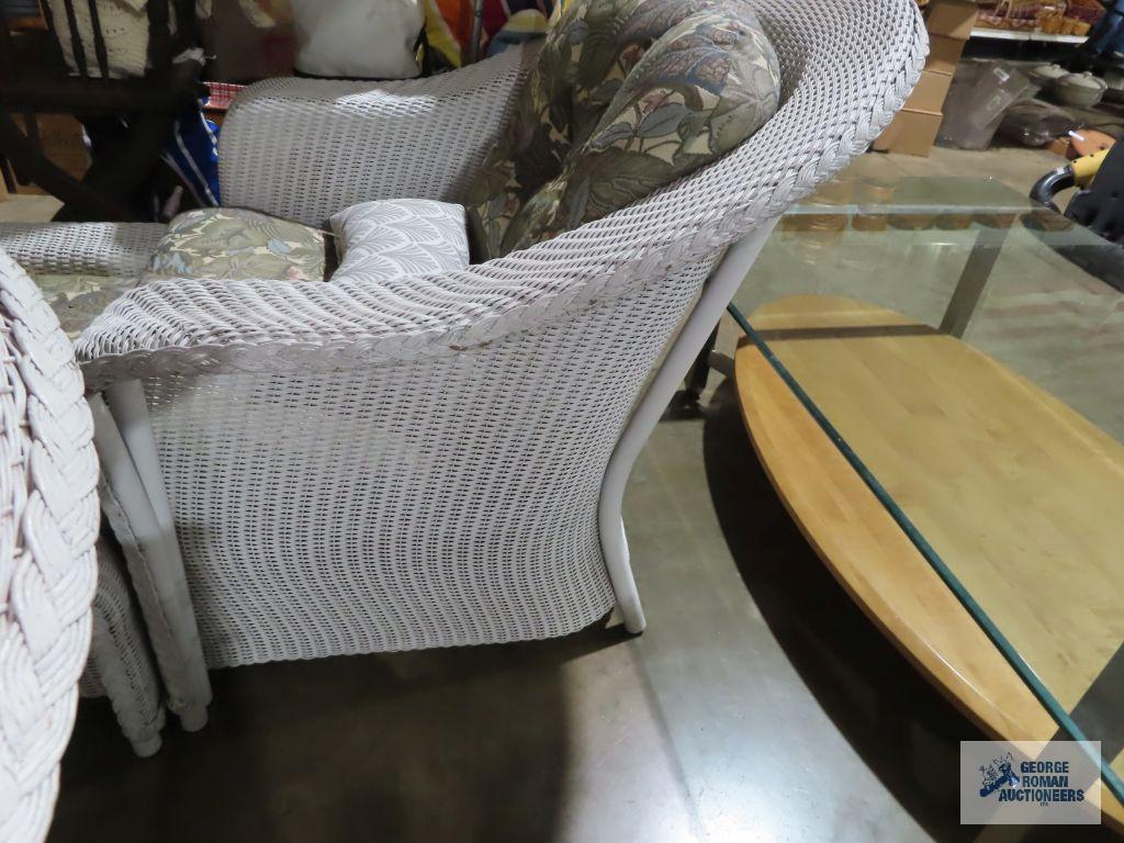 White wicker style chair and ottoman