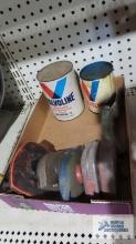 Oil cans, measuring tapes, and oil spout