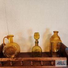 Three amber glass bottles