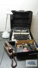 Royal typewriter, desk lamp, and rotary wall phone