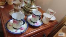 Lot of hand-painted cups and saucers