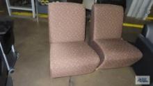2 brown decorative chairs
