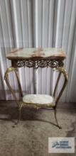 Antique Victorian style metal stand with marble inserts. 33 in tall by 20 inches long by 12 in wide