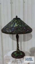 Reproduction Tiffany style firefly motif lamp. 23 in. tall. Shade is 17 in. wide at base