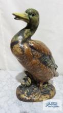 Duck ceramic figurine. 11 in. tall. Marked D inside a triangle on bottom.