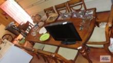 Beautiful dining room table with one leaf and 8 chairs, 2 are host chairs