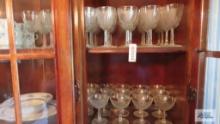 clear glass stemware on two shelves
