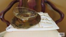 Gold trays and basket, gold trim placemats, napkins and napkin holders