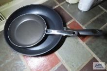 two nonstick skillets. one is Farberware.