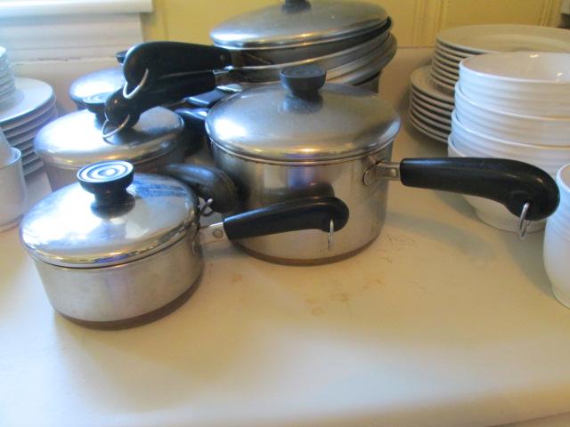 Seven Revere Ware Pots and Pans with Lids