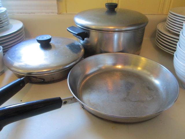 Seven Revere Ware Pots and Pans with Lids