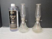 Pair of Small Clear Glass Oil Lamps and Bottle of Lamp Oil