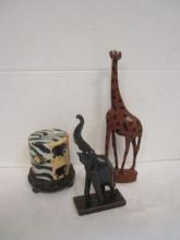 Carved Wood Elephant and Giraffe Figurines and Swazi Candle on Stand