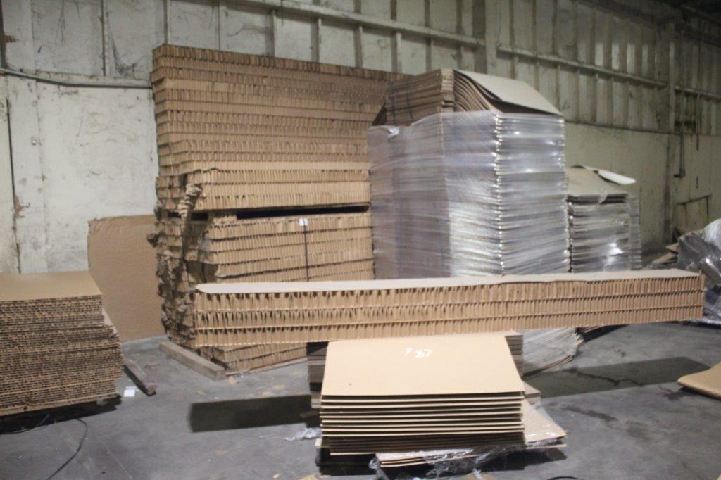 All Remaining Cardboard Packaging Components In Corner of Warehouse as Mark