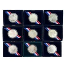 Lot of 9 uncirculated U.S. commemorative silver dollars