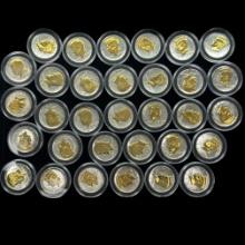Lot of 32 different uncirculated gold-accented U.S. Kennedy half dollars