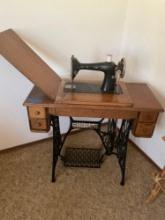 Vintage Singer sewing machine with cabinet, placard stamped AC490314