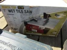 662. 7 INCH BENCH TOP WET TILE SAW, TROWELS