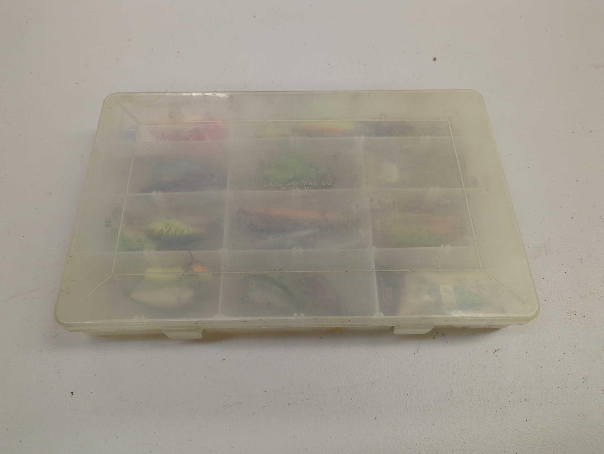 Tackle Box and contents including various fishing lures of similar style. Comes as is shown in