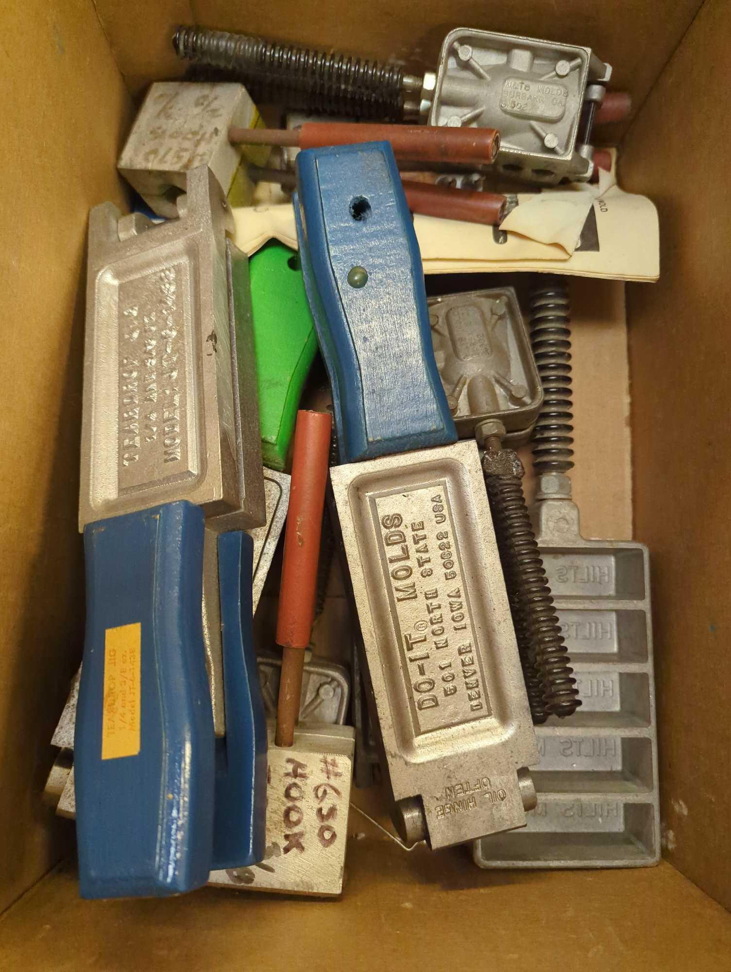 Box of assorted Do-It metal sinker and jig molds. Comes as is shown in photos. Appears to be used.