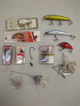 Tackle Box and contents including various fishing lures and other fishing accessories. Comes as is