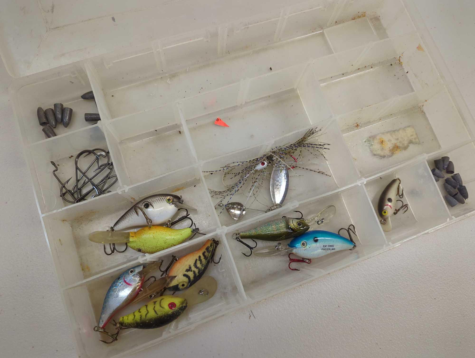 Tackle Box and contents including various fishing lures and other fishing accessories. Comes as is