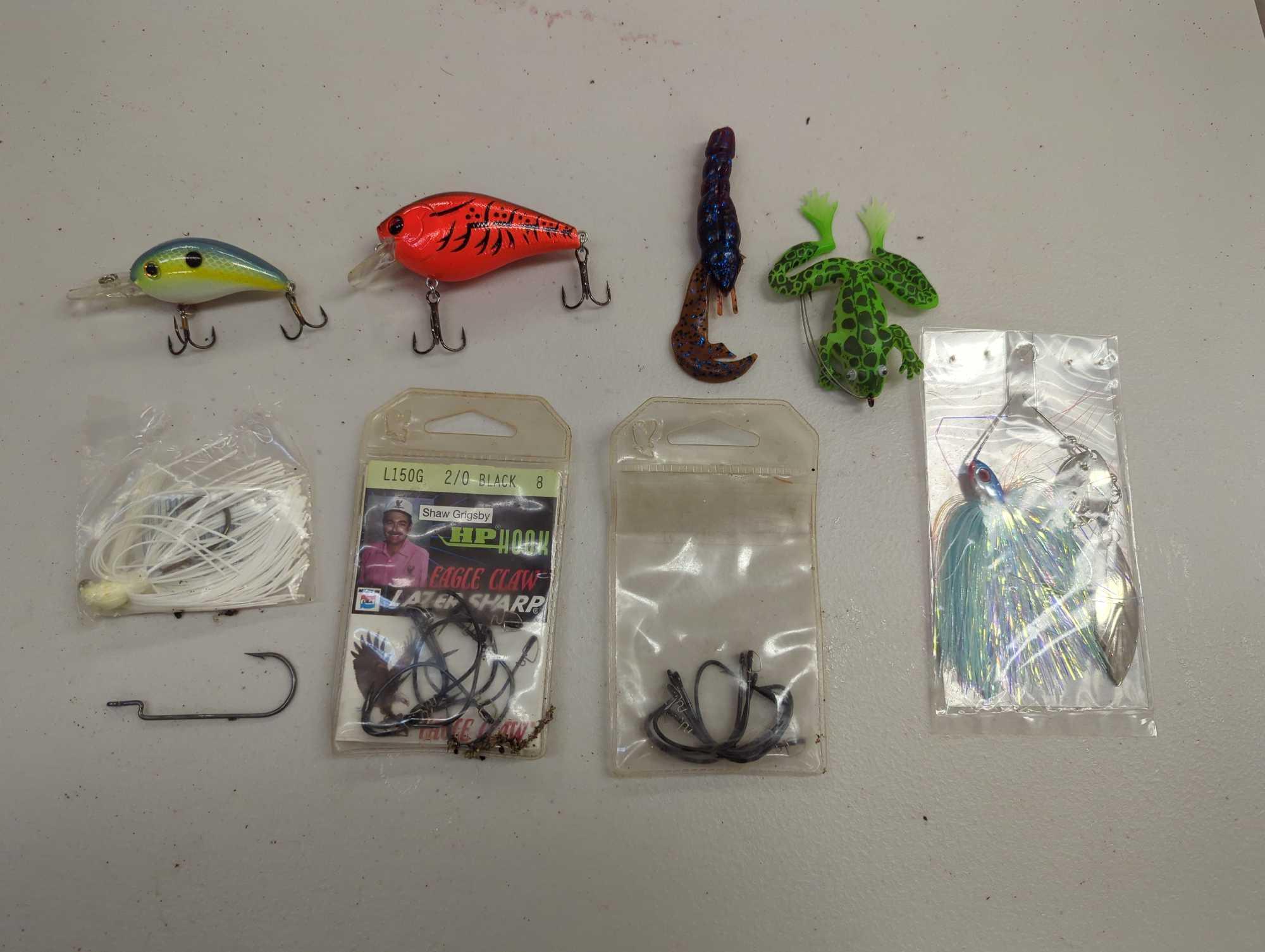 Tackle Box and contents including various fishing lures and other fishing accessories. Comes as is