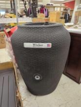 Algreen Wicker 50 Gal. Black Rain Barrel. Comes as it's shown. Appears to be new but damaged, refer