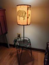 (LR) LOT OF 2 ITEMS TO INCLUDE, BLACK METAL TABLE LAMP 22 1/4"H, AND METAL PLANTER, 10"D 15 1/4"H
