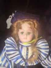 (GAR) Red Haired and Green Eyed Porcelain Doll Wearing Blue Dress with White and Blue Strip on Top
