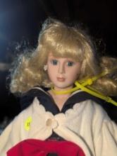 (GAR) Blonde Haired and Blue Eyed Porcelain Doll Wearing a Blue and White Sailors Dress with White