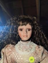 (GAR) Brown Haired and Brown Eyed Porcelain Doll Wearing a Light Pink Victorian Style Dress with