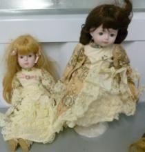 TWO PORCELAIN DOLLS ONE ON STAND
