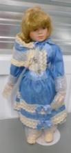 LARGE PORCELAIN DOLL ON STAND