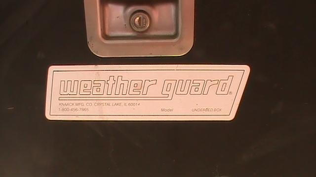 Two weather guard under bed metal black boxes