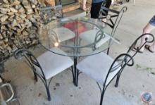 Glass and Iron patio table and (4) chairs