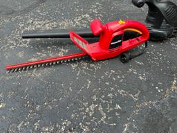 Homelite Hedge Trimmer and a Remington Electric Blower/Vac, Being used at Home
