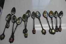 11 COLLECTORS SPOONS WITH PAINTED PORCELAIN
