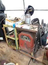 Welding Station, with Lincoln AC225 amp stick welder with leads, MIG gas bottle, and wire