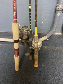 2 bait canteens and fishing poles