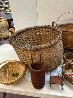 Baskets two watering cans and a wicker baby stroller