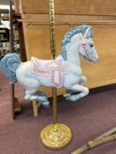 carousel horse on brass pole