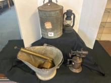 vintage cast-iron torch and vintage metal lamp, oil can, jug and
