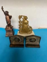Brass bookends and a statue of liberty