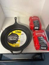 15 inch lodge cast iron skillet and two community dark roast coffee blends