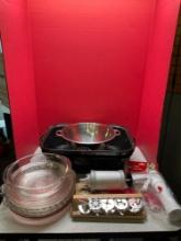 Roasting pan, strainer, Pyrex pie plate, and cookie decorating kits