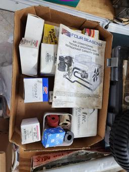 Tabletop Contents: Chevrolet Car Radios, Delco O rings, switches, fuses, tires polisher and more
